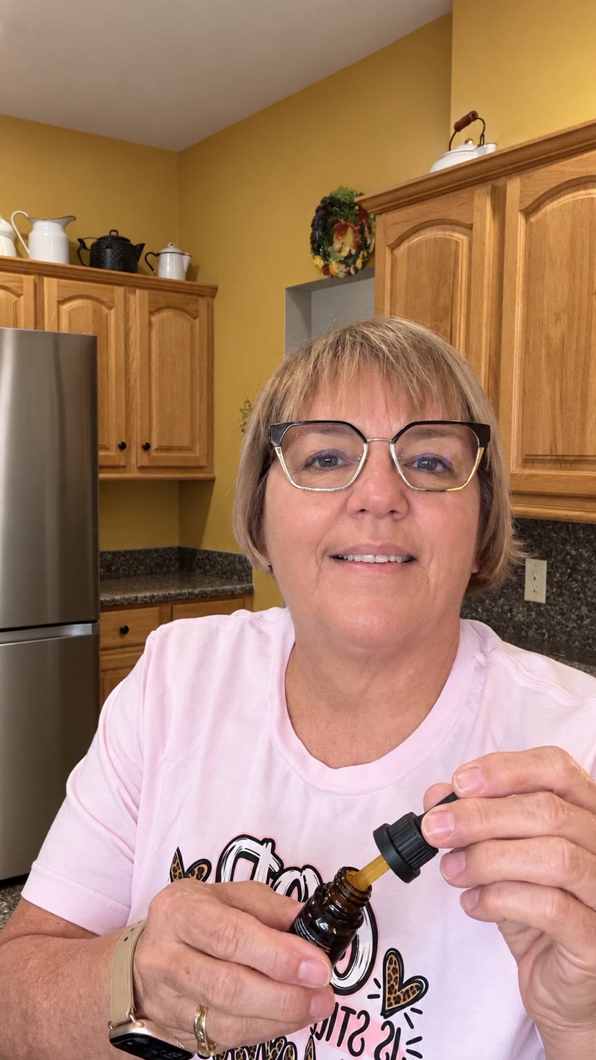 BJ in her kitchen holding her drops